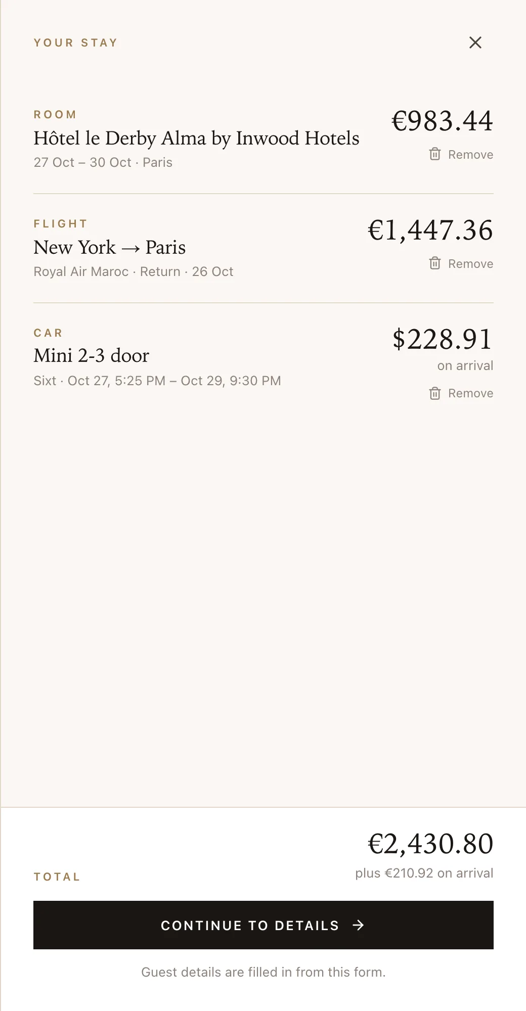 The guest’s stay on a hotel’s own site: the room, a New York to Paris return flight and a car rental, with one total and the rental amount due on arrival.